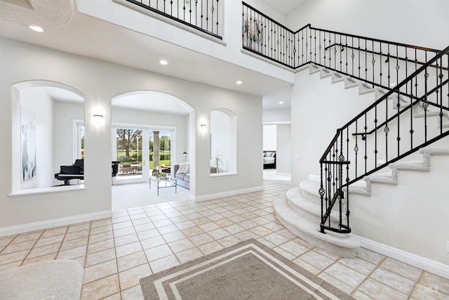 3586 N Croft Way, Eagle, ID 83616 - tiled foyer entrance featuring recessed lighting, stairs, baseboards, and arched walkways