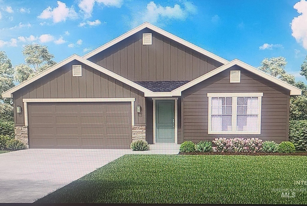 234 W Willow Dale Dr, Kuna, ID 83634 - view of front facade with an attached garage, a front yard, and concrete driveway