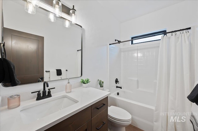 full bathroom featuring shower / bath combination with curtain, vanity, and toilet