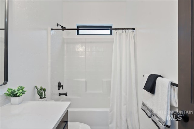 bathroom featuring shower / tub combo, vanity, and toilet