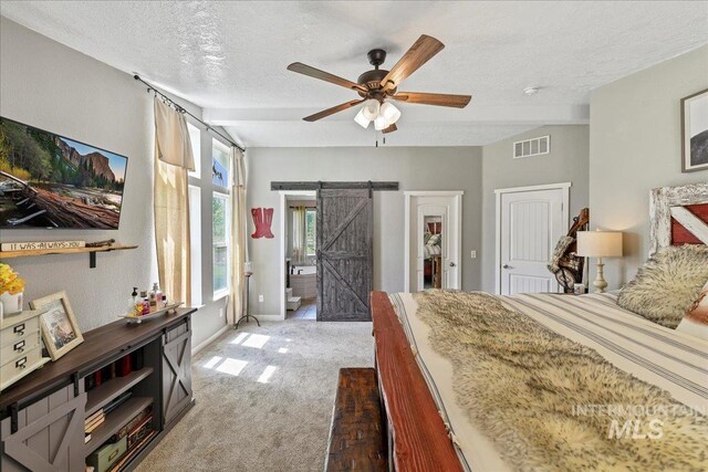 22969 Bumble Bee, Middleton, ID 83644 - bedroom with light carpet, a barn door, a textured ceiling, baseboards, and a ceiling fan