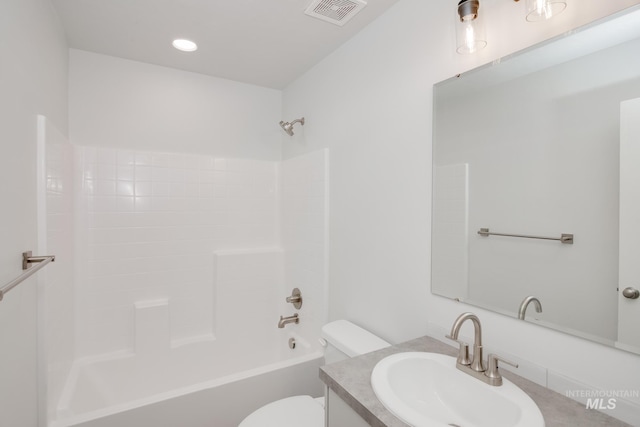 full bathroom with shower / tub combination, vanity, and toilet