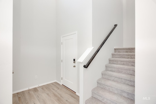 stairs with wood-type flooring