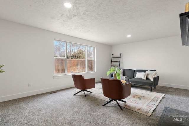 interior space with recessed lighting, visible vents, baseboards, and a textured ceiling