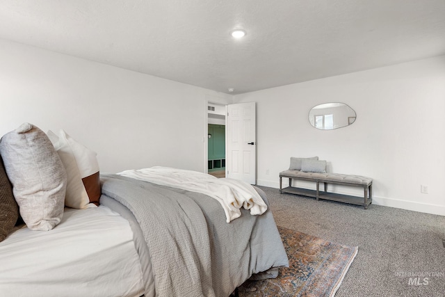 carpeted bedroom with baseboards