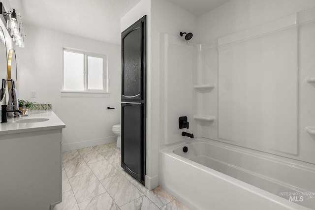 full bath with toilet, marble finish floor, shower / bathing tub combination, baseboards, and vanity