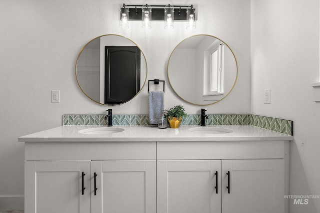 bathroom with double vanity and a sink