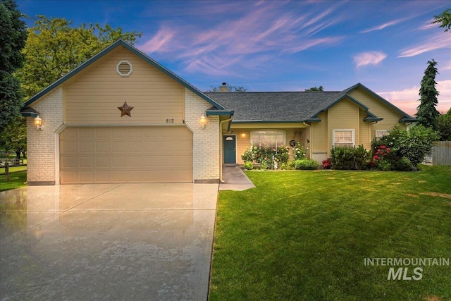 812 Ada Ct, Nampa, ID 83686 - ranch-style home with driveway, brick siding, an attached garage, a yard, and roof with shingles