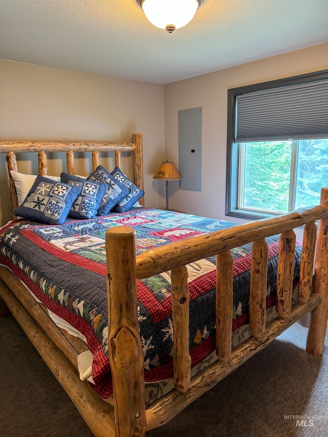 bedroom featuring carpet flooring and electric panel