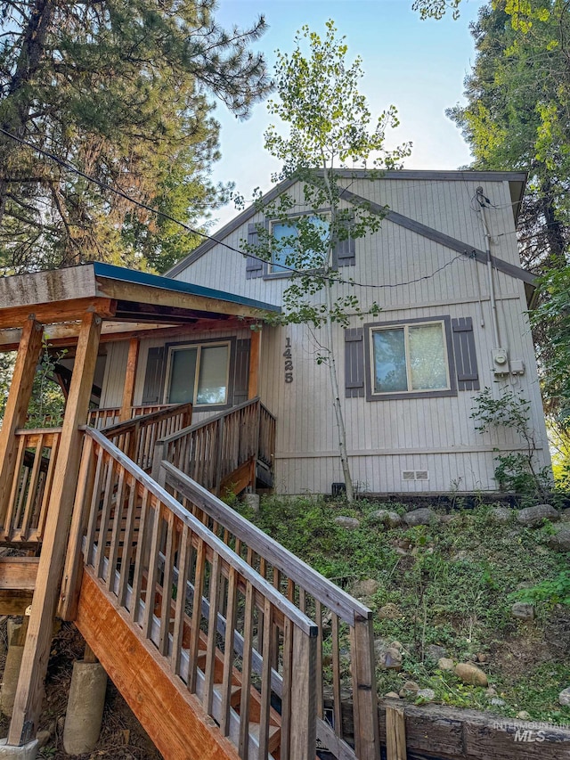 view of property exterior featuring a deck