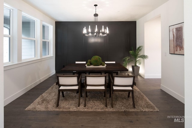 7755 W Flathead Lake St, Eagle, ID 83616 - dining space with baseboards, a chandelier, and wood finished floors