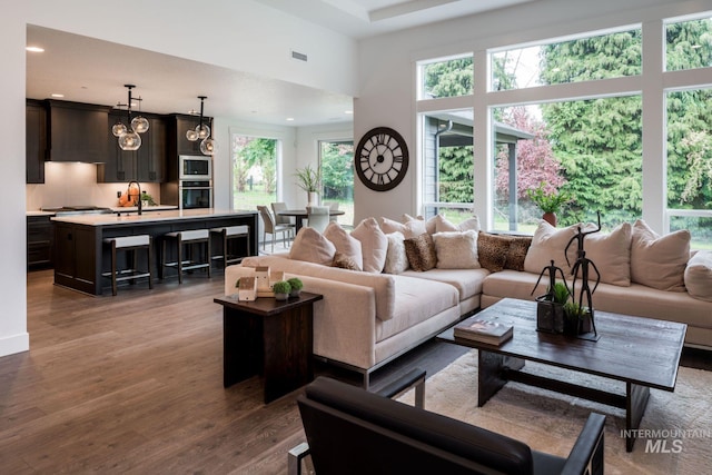 7755 W Flathead Lake St, Eagle, ID 83616 - living area featuring wood finished floors, recessed lighting, and a high ceiling