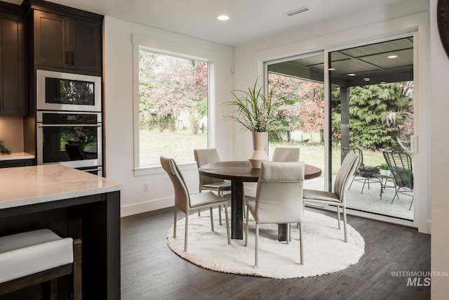 7755 W Flathead Lake St, Eagle, ID 83616 - dining area with dark wood finished floors, baseboards, and recessed lighting