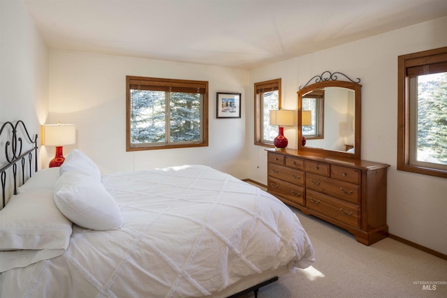 732 Morning Star Rd, Sun Valley, ID 83353 - bedroom featuring multiple windows, light colored carpet, and baseboards