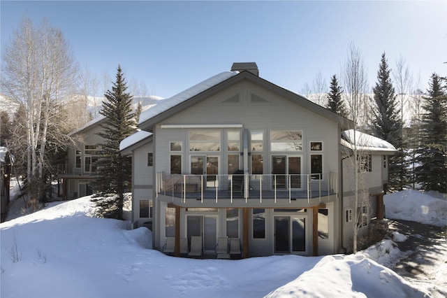 732 Morning Star Rd, Sun Valley, ID 83353 - snow covered rear of property with a balcony