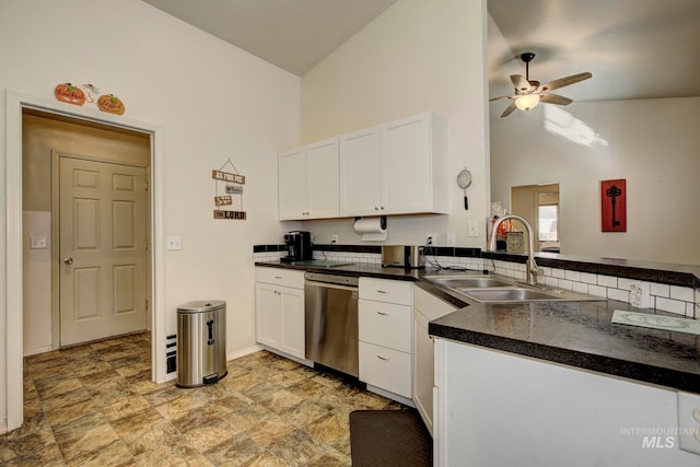 kitchen with sink, stainless steel dishwasher, white cabinets, high vaulted ceiling, and ceiling fan