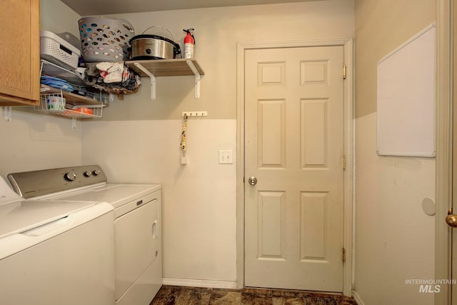 washroom with cabinets and separate washer and dryer