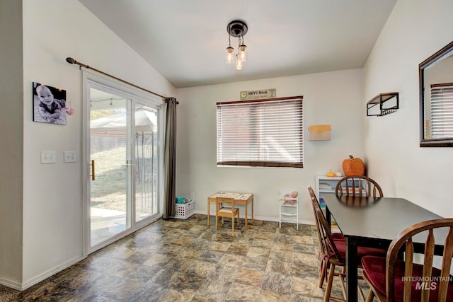 dining room with vaulted ceiling