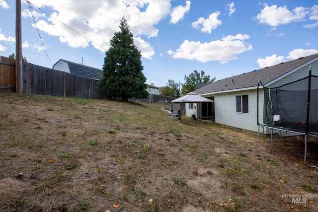 view of yard with a trampoline