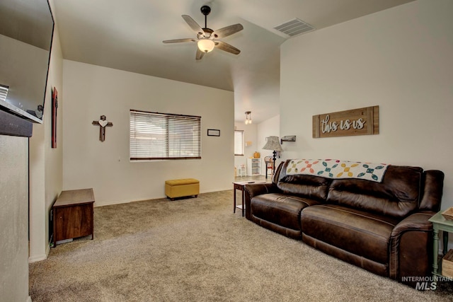 carpeted living room with vaulted ceiling and ceiling fan