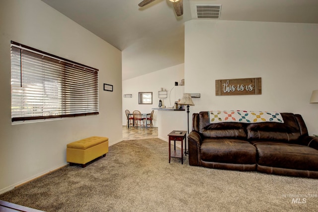 living room featuring lofted ceiling, carpet floors, and ceiling fan