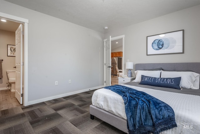 3438 5th St Unit D, Lewiston, ID 83501 - bedroom featuring freestanding refrigerator, baseboards, ensuite bath, recessed lighting, and carpet
