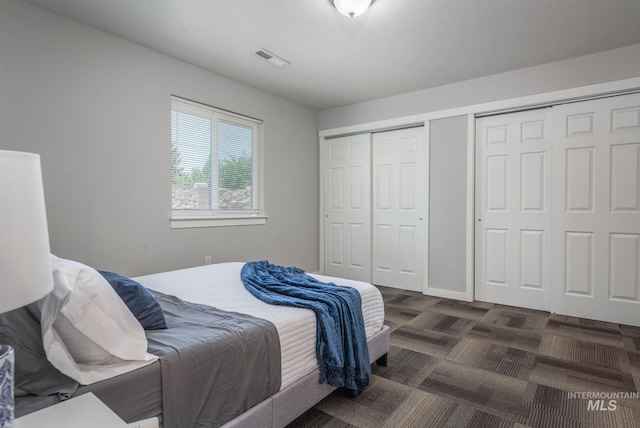 3438 5th St Unit D, Lewiston, ID 83501 - bedroom with multiple closets and dark colored carpet