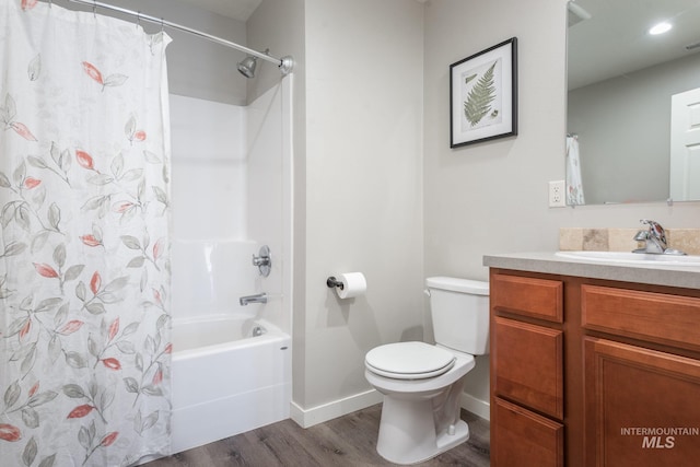3438 5th St Unit D, Lewiston, ID 83501 - bathroom featuring wood finished floors, vanity, toilet, shower / bath combination with curtain, and baseboards