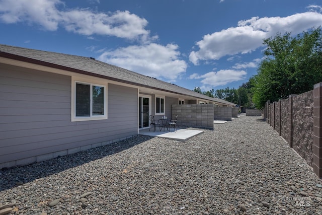 3438 5th St Unit D, Lewiston, ID 83501 - rear view of property with a patio and a fenced backyard