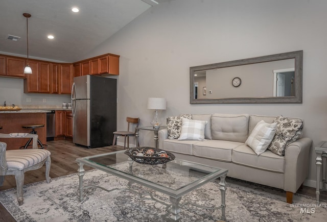 3438 5th St Unit D, Lewiston, ID 83501 - living area with wood finished floors, recessed lighting, and high vaulted ceiling