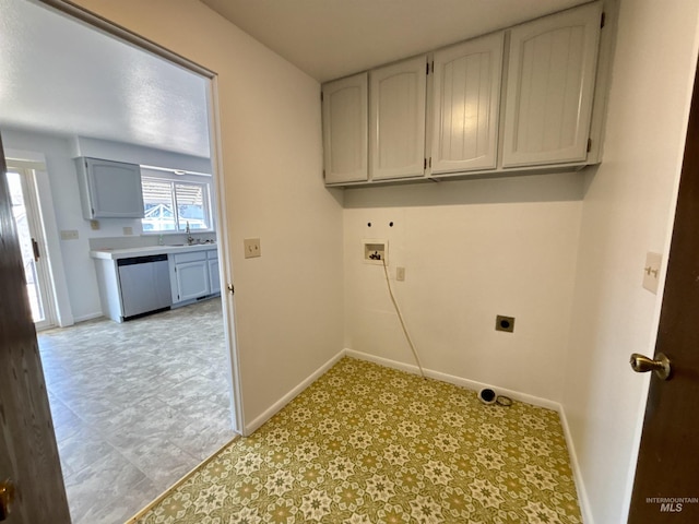 washroom featuring washer hookup, cabinets, and electric dryer hookup