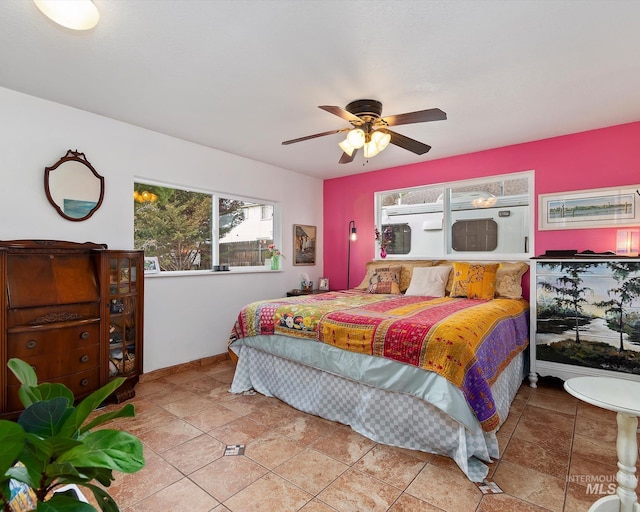 bedroom with tile patterned floors and ceiling fan