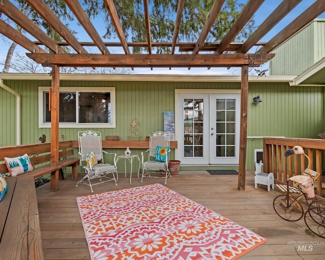 wooden terrace with french doors and a pergola