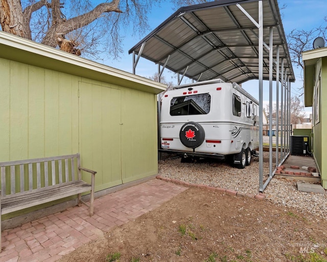 view of parking with a detached carport