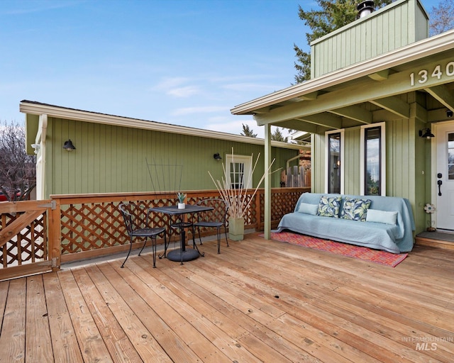 deck featuring outdoor lounge area