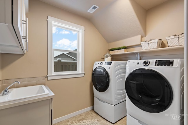 laundry room with washer and dryer and sink