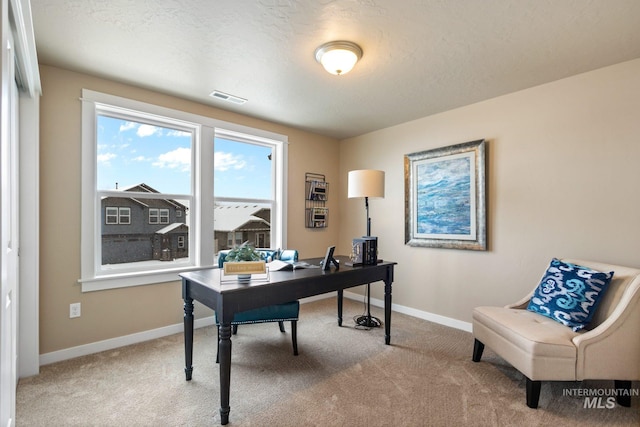 office area featuring light colored carpet