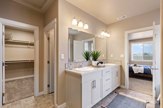 bathroom featuring double sink, tile flooring, and oversized vanity