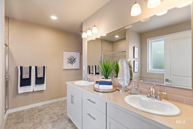 bathroom featuring an enclosed shower, tasteful backsplash, tile floors, and double sink vanity