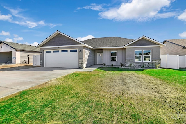 single story home with a front lawn and a garage