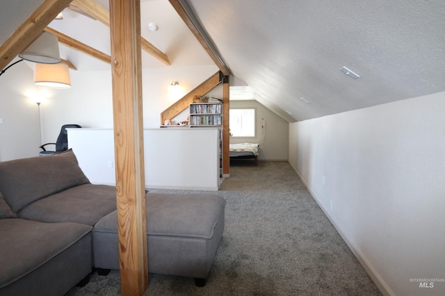 bonus room with lofted ceiling with beams, a textured ceiling, carpet flooring, and baseboards