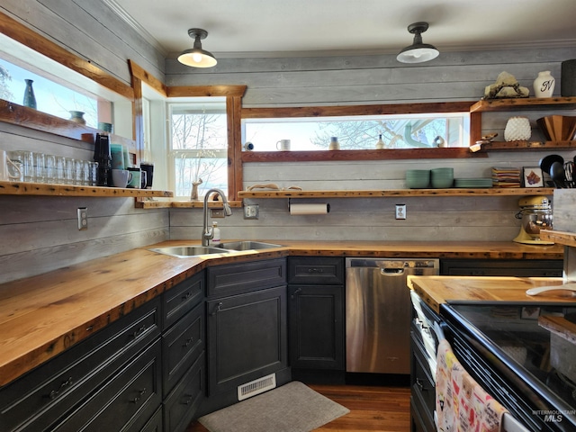 kitchen featuring dark wood finished floors, wooden counters, a sink, dark cabinets, and dishwasher