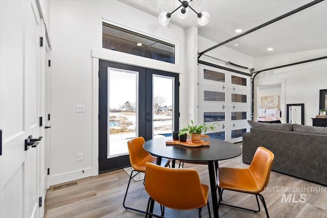 362-436 W London St, Middleton, ID 83644 - dining room featuring visible vents, baseboards, french doors, light wood-style floors, and recessed lighting