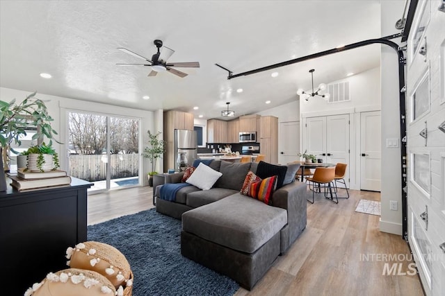 362-436 W London St, Middleton, ID 83644 - living area featuring visible vents, ceiling fan, vaulted ceiling, light wood-type flooring, and recessed lighting