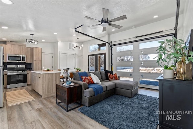362-436 W London St, Middleton, ID 83644 - living room with recessed lighting, visible vents, a textured ceiling, and light wood finished floors