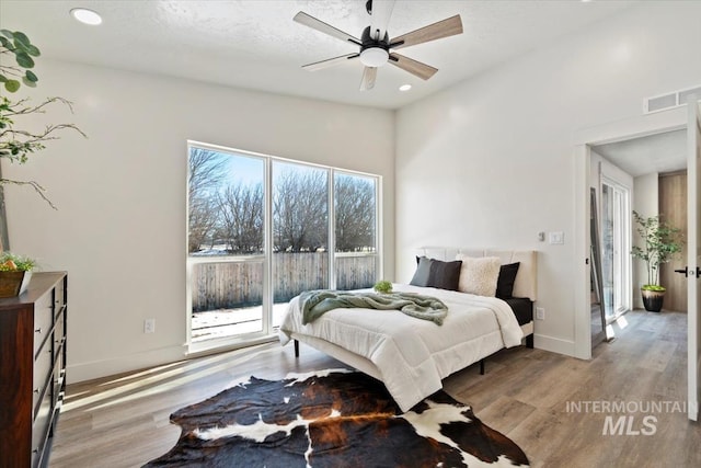 362-436 W London St, Middleton, ID 83644 - bedroom with wood finished floors, visible vents, and baseboards
