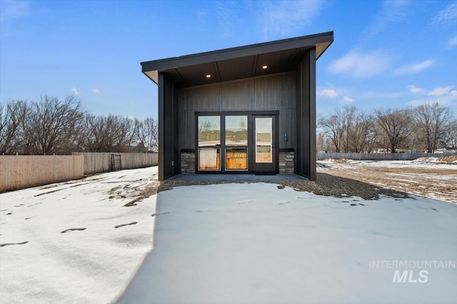 362-436 W London St, Middleton, ID 83644 - snow covered back of property with stone siding and fence