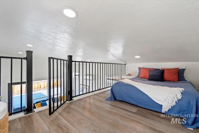 362-436 W London St, Middleton, ID 83644 - bedroom featuring a textured ceiling, wood finished floors, and recessed lighting