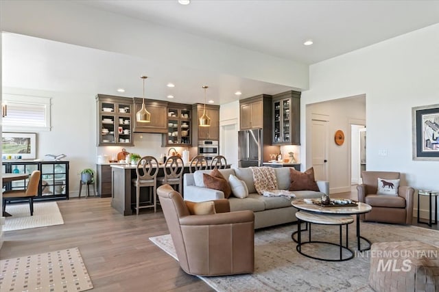 12013 W Zamalek Ct, Kuna, ID 83634 - living area with light wood-style flooring, recessed lighting, and baseboards