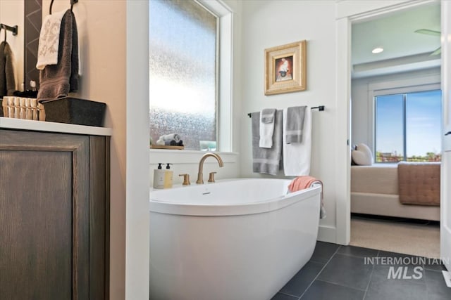 12013 W Zamalek Ct, Kuna, ID 83634 - bathroom with a freestanding tub, tile patterned flooring, and recessed lighting